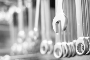 hanging wrench with a lot of wrenches in background