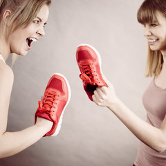 Women fighting with shoes