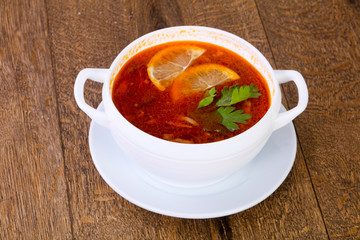 Solyanka soup with lemon