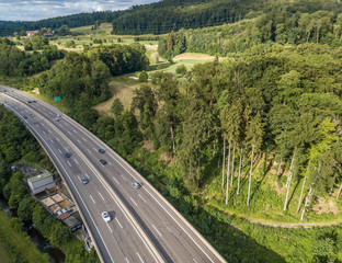  Aerial view of highway bridge in forest in Switzerland, Europe
