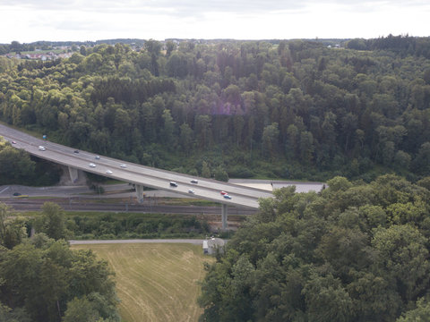 Aerial view of highway bridge in forest in Switzerland, Europe © Mario