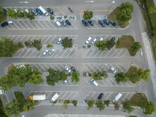 Aerial view of large parking lot with cars © Mario