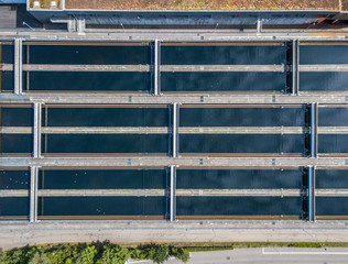 Aerial view of wastewater treatment plant with water pools in Europe