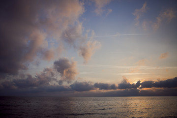 sunset clowds sea sky