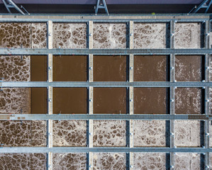 Aerial view of wastewater treatment plant with water pools in Europe