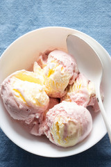 Raspberry ice cream with meringue pieces and clotted cream dairy ice cream