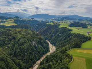 Fototapeta premium Aerial view of wild Sense river in Fribourg, Switzerland
