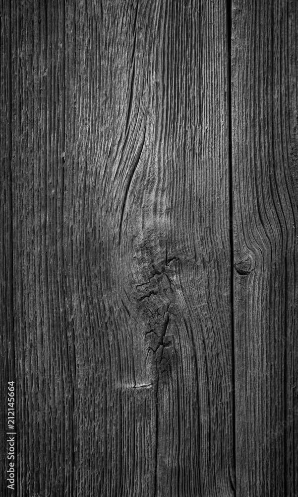 Aufkleber close-up of an old and unpainted rustic wood board texture background in black and white with vignet