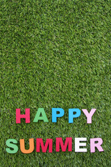 summer background with letters on green grass