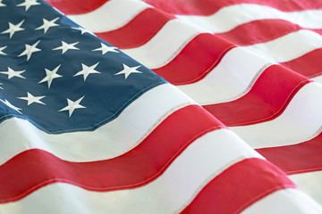 Obraz premium Close up patriotic photograph of an American Flag rippling in the breeze.