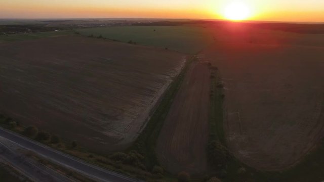 Aerial view of the landscape and fields on sunset