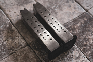 High Capacity 16 Round .40caliber Pistol Magazines Chrome on Stone Tiles