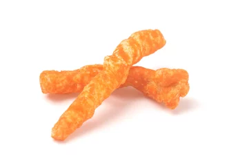 Foto op Plexiglas Long and Thing Crunchy Orange Cheesy Chips on a White Background © pamela_d_mcadams