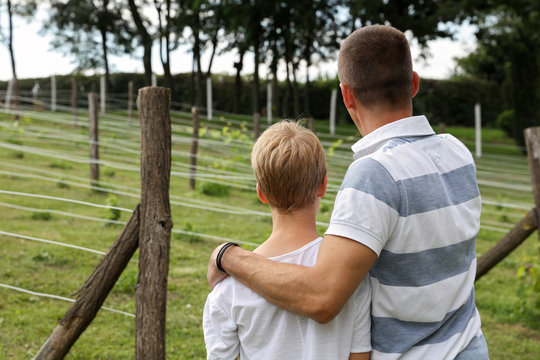 Father And Son In Vineyard. Two Generations, Family Values. Summer Holiday On Farm, Including Kids In Family Business Concept