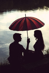 Young couple with umbrella