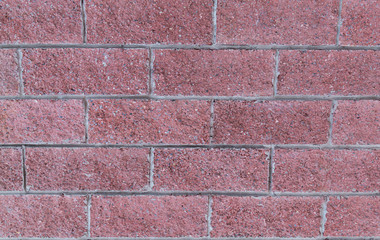 base brick wall terracotta row of rectangular stones with gray lines background urban part of the fort
