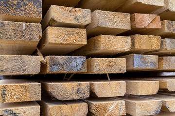 background base stack of boards end face storage of building materials natural material light pattern