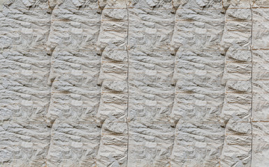 gray cement surface with lines of cracks base construction effect masonry uneven weathered stone limestone stone background