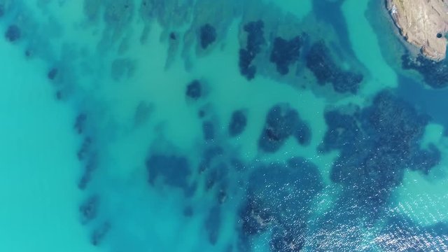 Aerial top down flight over The Stair of the Turks in Italian Scala dei Turchi a rocky cliff on the coast of Realmonte the scala is formed by marl a sedimentary rock with a characteristic white color