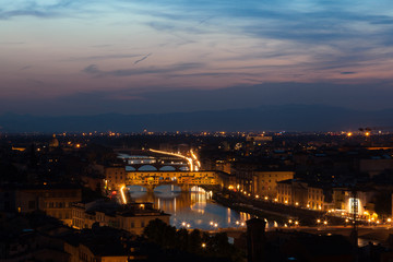 Fototapeta na wymiar Florence city during sunset. Panoramic view to the river Arno, with Ponte Vecchio, Palazzo Vecchio and Cathedral of Santa Maria del Fiore (Duomo), Florence, Italy