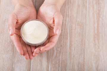 Collagen protein powder - Hydrolyzed. Woman's hands