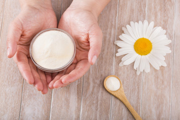 Collagen protein powder - Hydrolyzed. Woman's hands