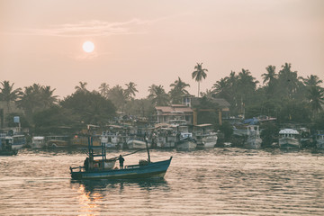 Sunrise at fishing harbor in Sri Lanka.