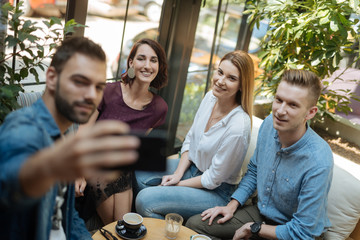 Friends at a coffee shop during a summer vacation