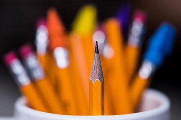 #2 Yellow wooden Pencils in a Cup with a very shallow depth of field