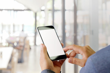 Cropped shot of an unrecognizable man using smartphone in cafe.