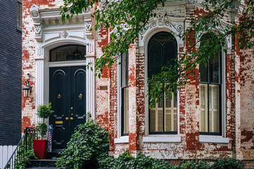 Fototapeta na wymiar A brick row house in Georgetown, Washington, DC.