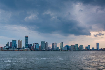 Fototapeta premium A view of the Jersey City skyline from Battery Park City, in Lower Manhattan, New York City