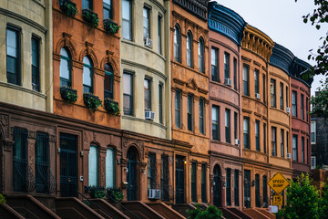Colorful row houses in Harlem, Manhattan, New York City.