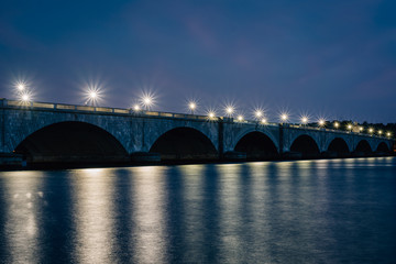 Fototapeta na wymiar The Arlington Memorial Bridge and Potomac River at night, in Washington, DC.
