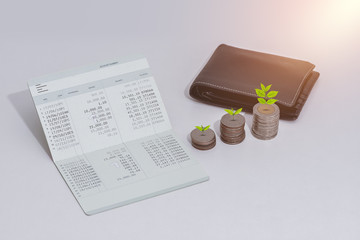 stack of coins and account book bank on the table