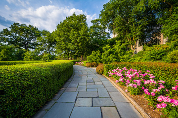 Walkway and flowers at the Conservatory Garden, in Central Park, Manhattan, New York City.