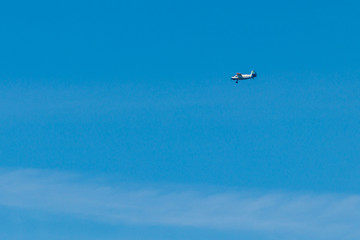 Biplane flying in blue sky