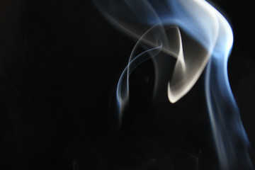 Obraz premium Smoke background / Smoke is a collection of airborne solid and liquid particulates and gases emitted when a material undergoes combustion 