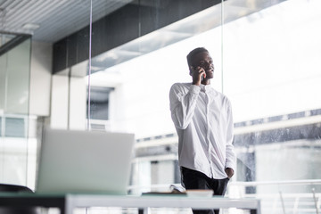 Portrait of a happy casual black man at modern office.