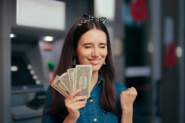 Excited Woman Receiving Salary at ATM Teller Machine
