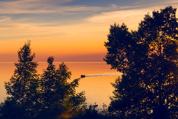 Fototapeta premium Fishing boat on Lake Superior at sunset