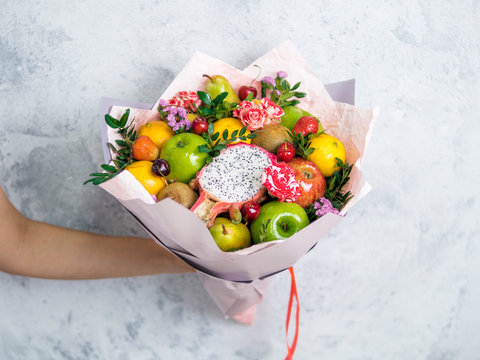 Eating bouquet in female hands