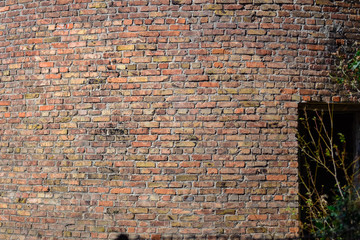 old red brick wall texture background with door