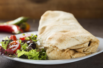 Pork and beef fajita wrap sandwich with salad