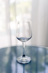 One empty wineglass on the table