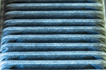 Dirty air filter for car, automotive spare part at maintenance repair service station.