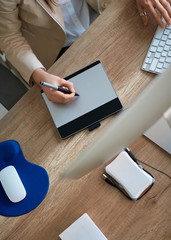 business working desk - designer working on the pen table in office top view.