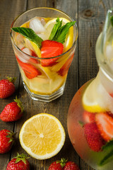 Lemonade with lemon and strawberry, mint and ice