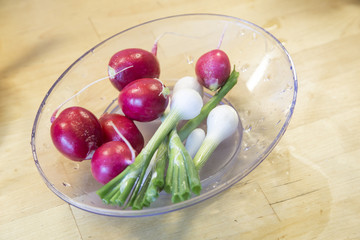 Fresh washed vegetables on wooden kitchen table