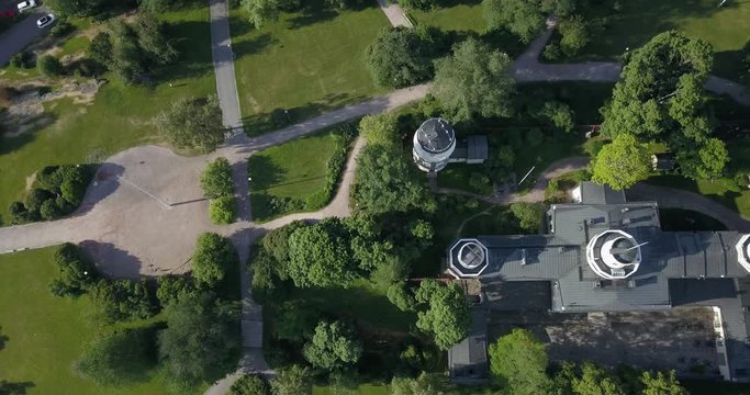4K summer day aerial video of Helsinki Kaivopuisto central park with Observatory, ctyscape view, park woods area around it, in capital of Finland Suomi, northern Europe